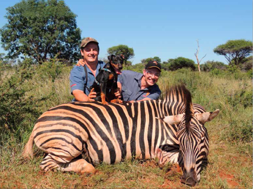 Denis, Kobus and tracker dog with Denis' zebra.