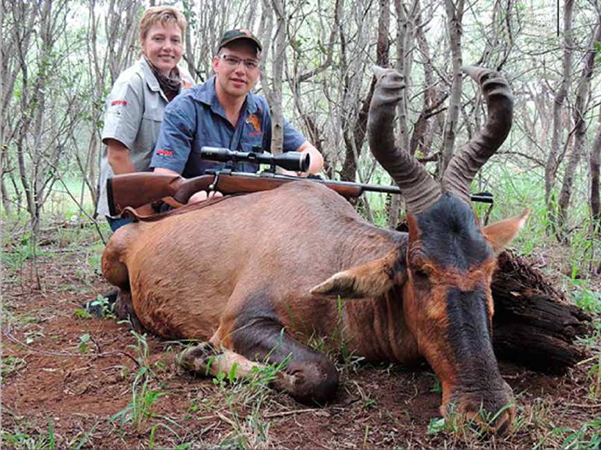 Denis, Charmaine and Denis' red hartebeest.